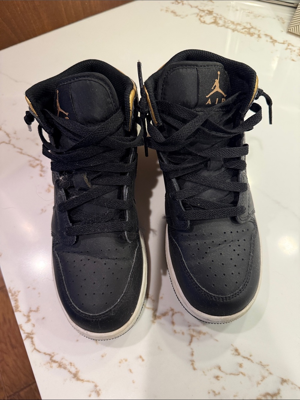 Jordan Black and Gold Low-Top Sneakers